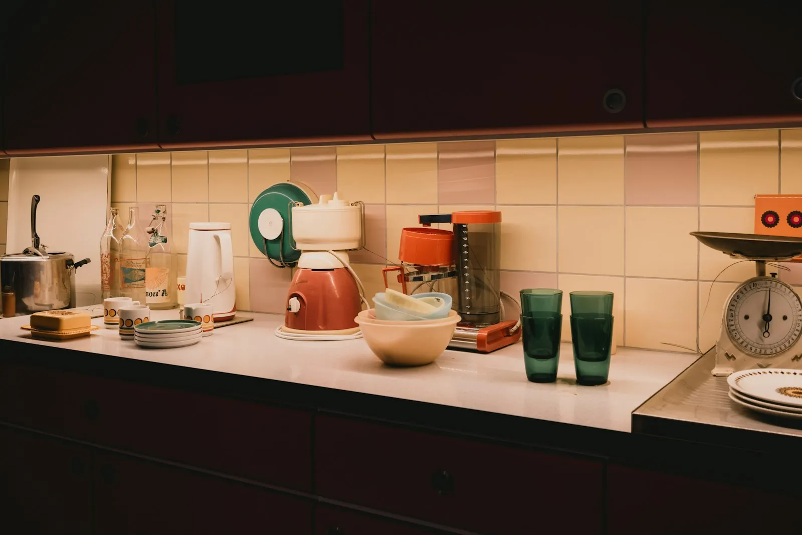 A kitchen counter lined with small electrical appliances.